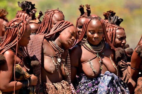 Mourning Himba women at a funeral, the widow in the middle, Omohanja, Kaokoland, Kunene, Namibia,