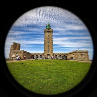 Cap Fréhel lighthouse with tourists, Emerald Coast, Brittany, France, Europe