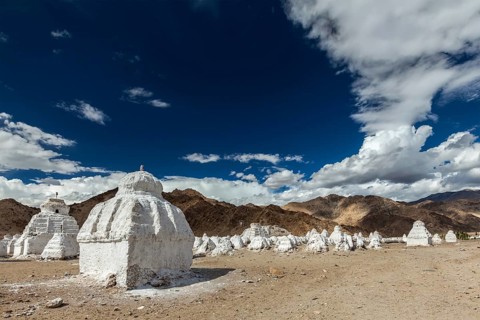 Whitewashed chortens (Tibetan Buddhist stupas) . Ladakh, Jammu and Kashmir, India, Asia