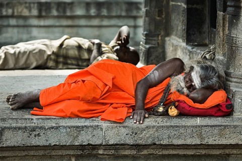 TIRUVANAMALLAI, INDIA, JANUARY 7, 2010: Sadhu, religious ascetic or holy person, sleeping in Hindu