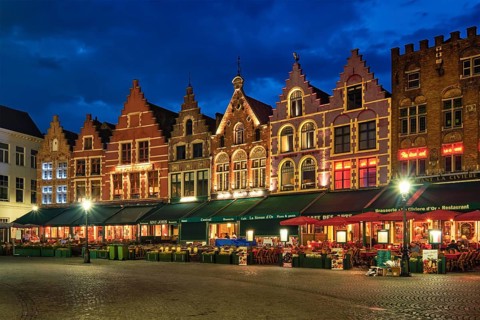 Bruges, Belgium, May 29, 2018: Bruges Grote markt square famous tourist place with many cafe and