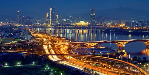 Aerial panorama of Seoul downtown cityscape and Seongsan bridge over Han River in twilight. Seoul,