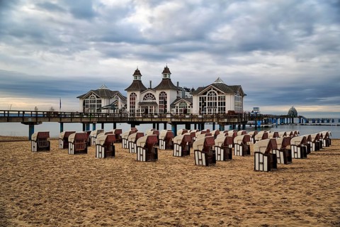 Empty beach chairs in front of the pier Sellin at dusk, long exposure, Baltic resort Sellin, Insel
