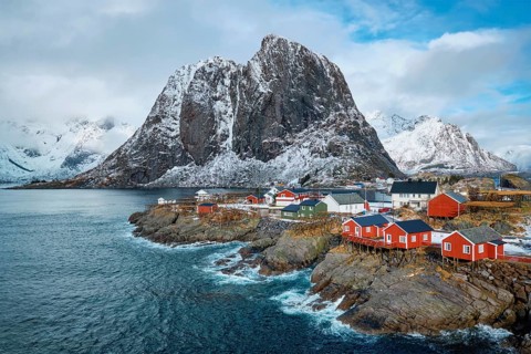 Hamnoy fishing village with red rorbu houses in Norwegian fjord in winter. Lofoten Islands, Norway,