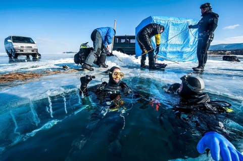 Scuba divers after an ice dive, Lake Baikal, Pribaikalsky National Park, Irkutsk Province, Siberia,