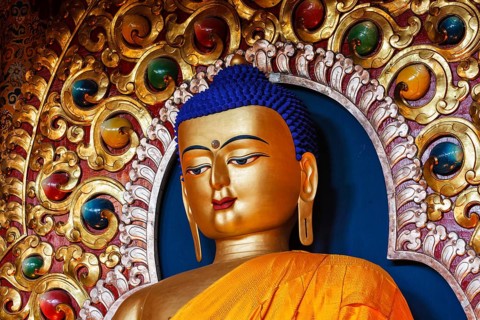 Gilded statue of Sakyamuni Buddha in Tsuglagkhang temple. McLeod Ganj, Himachal Pradesh, India,