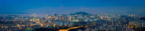 Panorama of Seoul downtown cityscape illuminated with lights and Namsan Seoul Tower in the evening