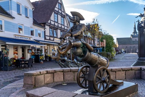 Munchausen figure The ride on the cannonball at the Munchausen fountain in Bodenwerder, Lower