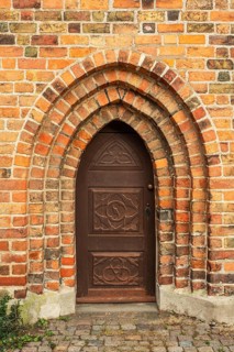 Old door in a brick wall in the monastery church in Ystad, Skåne Country, Sweden, Scandinavia,