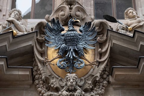 Sculptural imperial eagle above an entrance portal of the Old Town Hall, built in 1616, Nuremberg,