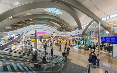 Abu Dhabi Airport, Zayed International Airport with passengers. Duty free shop. The new Terminal A