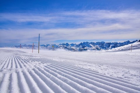 Ski slope in the ski area Hoher Ifen in Kleinwalstertal, in the foreground tracks of a snow