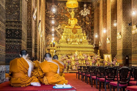 Wat Pho temple in Bangkok near the Grand Palace. Buddhist monks during a religious ceremony.