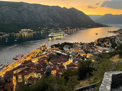 Evening atmosphere, sunset, view of the old town of Kotor from above, Bay of Kotor, cruise ship,