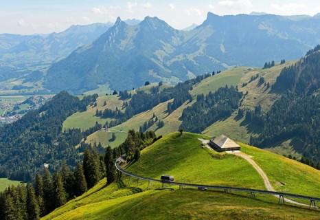 Idyllic pre-Alpine landscape in the Gruyère region with the Plan-Francey funicular, Moleson,