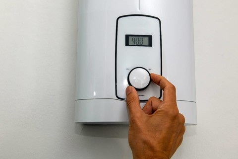 Instantaneous water heater for hot water shower washbasin bidet is set at temperature of 40 degrees