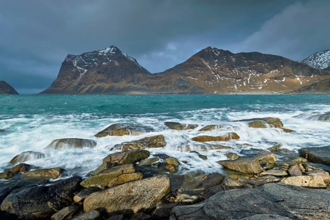 Rocky coast of fjord of Norwegian sea in winter. Lofoten islands, Norway, Europe