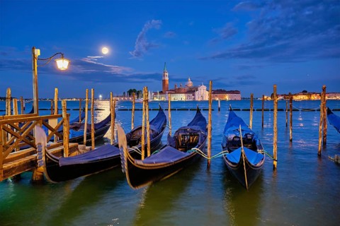 Romantic vacation Venice travel background, gondolas at Saint Mark (San Marco) square and Basilica