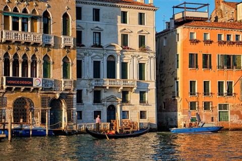 VENICE, ITALY, JUNE 27, 2018: Grand Canal with boats and gondolas on sunset, Venice, Italy, Europe