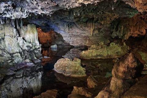 Neptune cave, stalactite cave with lake, colourful rocks, bizarre landscape, Sardinia, Italy,