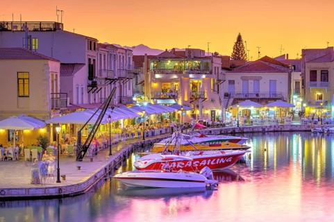Venetian harbour, dusk, night shots, orange sky, colourful rows of houses, water reflection,