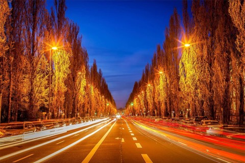 Street road in evening with motion blur. Munich, Germany, Europe