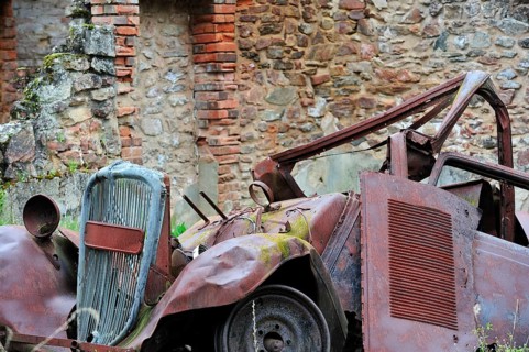 Burnt-out car in the garage. The burnt village of Oradour-sur-Glane was destroyed on 10 June 1944