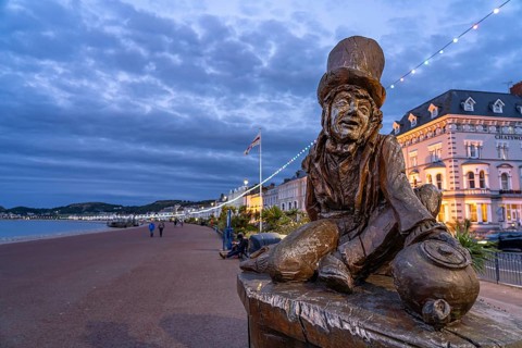 Sculpture of the Mad Hatter or The Mad Hatter from Alice in Wonderland on the promenade of the