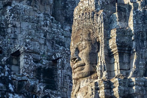 Giant stone-carved face of the Bodhisattva Lokeshvara, also known as Avalokiteshvara, Bayon Temple,