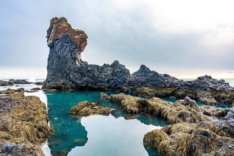 Beautiful rock formations by the sea at Djupalonssandur beach on the Snaefellsnes peninsula in