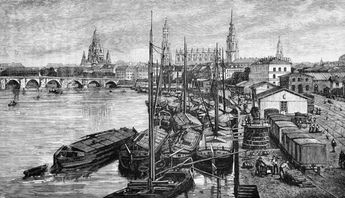 City view of the Saxon capital Dresden on the Elbe, harbour with barges, railway with freight