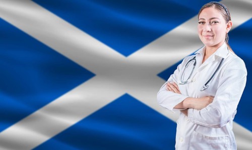Female doctor on Scottish flag. Doctor with crossed arms on Scottish flag. Scotland health and care