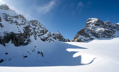 Ascent to the summit of Piz Kesch on the Vadret da Porchabella glacier, pointed mountain peaks with