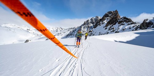 Ski tourer with rope, rope team on the Vadret da Porchabella glacier on the ascent to the summit of