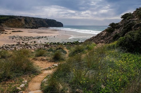 Raposeira, Algarve, Portugal - Surfer beach Praia do Zavial on the Mediterranean coast between