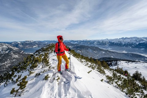 Ski tourer at the summit of Simetsberg, mountain panorama, Estergebirge, Bavarian Prealps, Bavaria