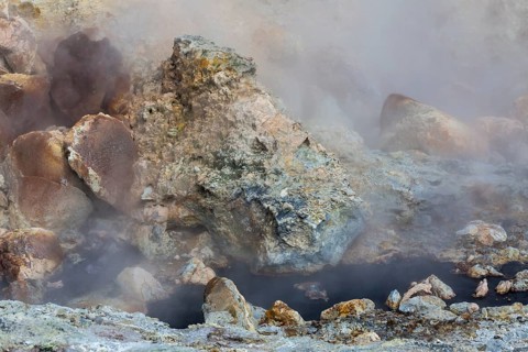 Solfatara field with hot pools and boiling mud at Seltun, Reykjanes nature reserve