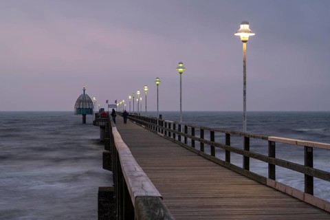 Illuminated Vineta Bridge, pier with diving gondola, blue hour, Zinnowitz, Usedom Island, Baltic