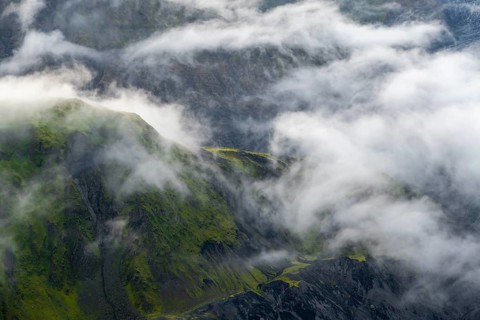 Fog, clouds moving around moss-covered mountains, impressive landscape, Pakgil, Iceland, Europe