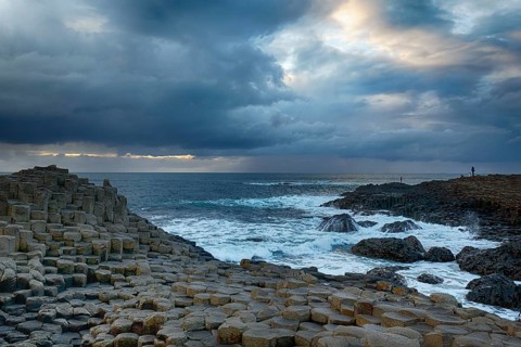 Rocky coast with basalt columns, coastline, dusk, rain clouds, Giant's Causeway, Giants Causeway,