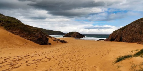 Cliff on sandy beach, bay, Boyeeght Beach, Murder Hole Beach, rain clouds, Sheephaven Bay, Rosguill