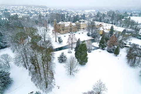 Herdringen Castle seen from above in the snow, Herdringen, Arnsberg, Hochsauerlandkreis, North