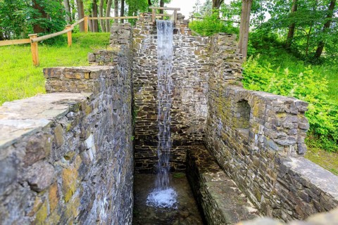 Ruins of the Sendig mill with wheel chamber and waterfall, oldest paper mill, Zwönitz, Erzgebirge,