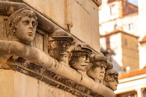 Famous heads on the façade of the Cathedral of St James, UNESCO World Heritage Site in Sibenik,