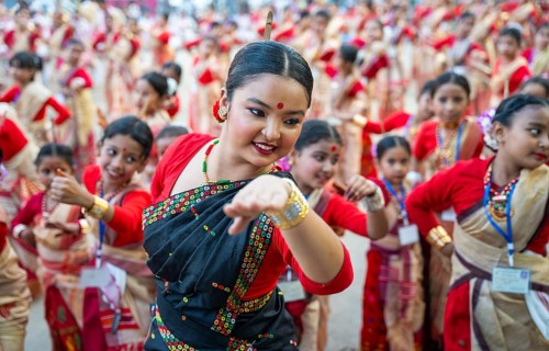 Participants with an instructor dance on the final day of a Bihu dance workshop ahead of Rongali