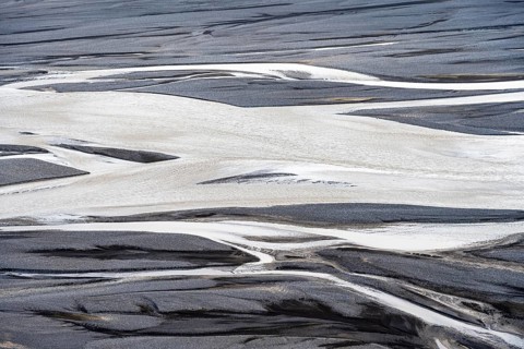 Detail, structure, river course in a gravel bed with black sand, meandering river, Dímonarhellir,
