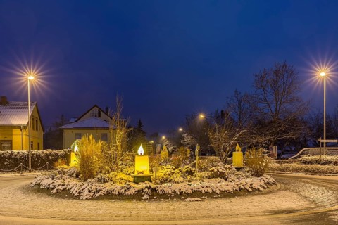 Advent candles at the roundabout, illuminated, snowy and at dusk, Coswig, Saxony, Germany, Europe