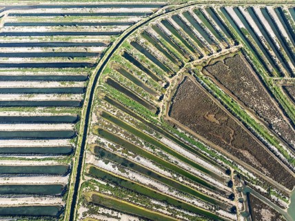 Saline ponds at the salt works of Isla Cristina. Aerial view. Drone shot. Huelva province,