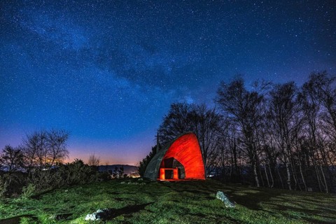 Milky way in the beautiful illuminated hermitage of Agiña, Navarra