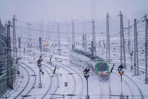 Winter weather, heavy snowfall, railway tracks in front of Essen main station, S-Bahn train, North